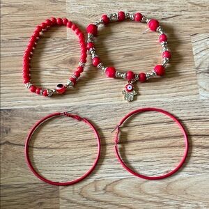 Two red bracelets and red hoop earrings